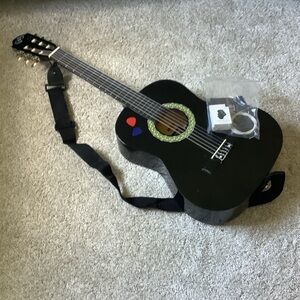 Black Acoustic Guitar with Strap and Accessories